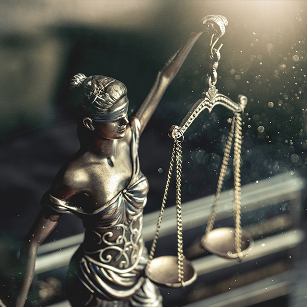 Figure of Blind Justice Holding Scales